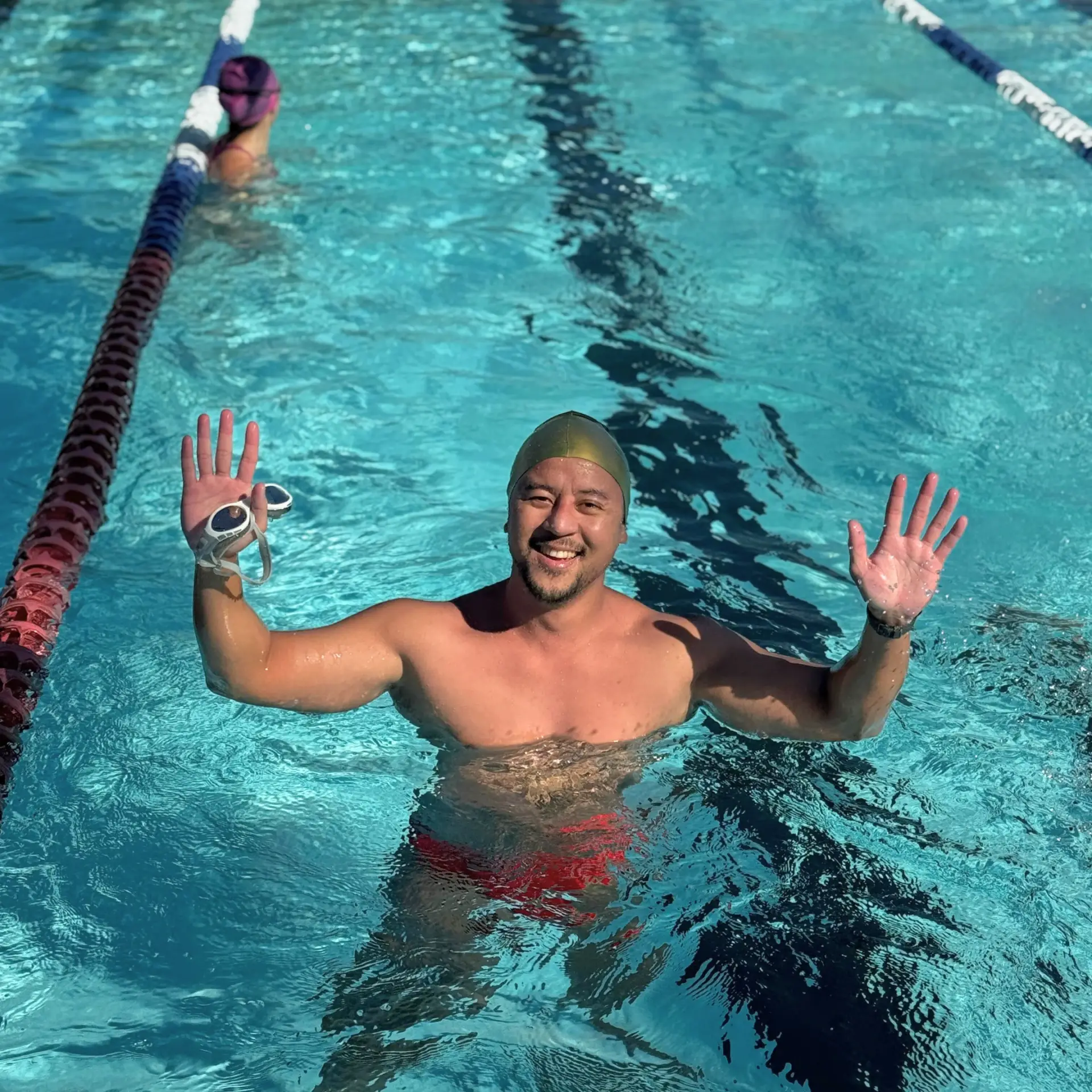 Adult swimming lessons in Sydney at Prince Alfred Park Pool with swimmers practising freestyle in outdoor lanes.