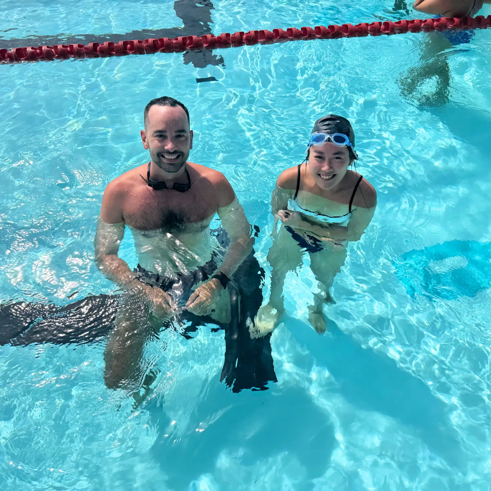 Two adult swimmers smiling during Sydney swimming lesson for Different Strokes Swimming at Victoria Park Pool.
